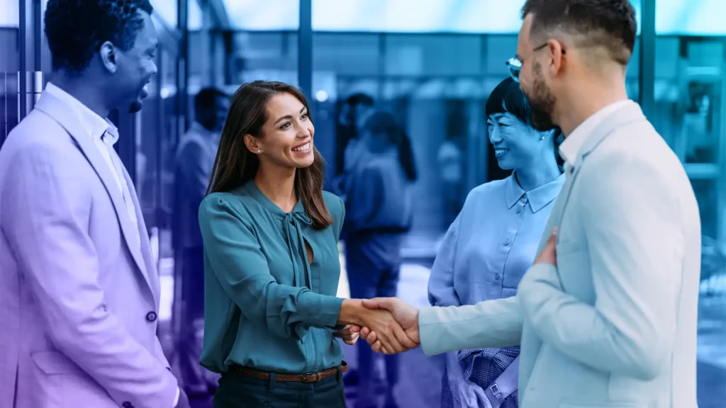 Business professionals shaking hands